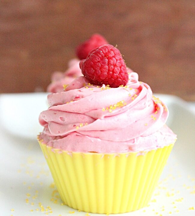 Two Lemon Cupcakes with Raspberry Buttercream Frosting- Big Green House #cupcake #lemon #baking #raspberry #buttercreamfrosting