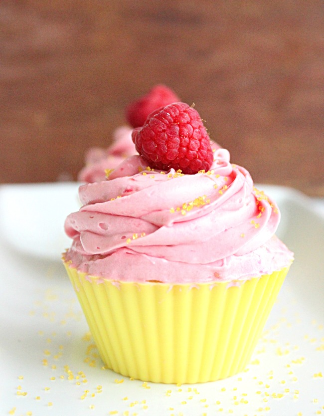 Two Lemon Cupcakes with Raspberry Buttercream Frosting- Big Green House #cupcake #lemon #baking #raspberry #buttercreamfrosting