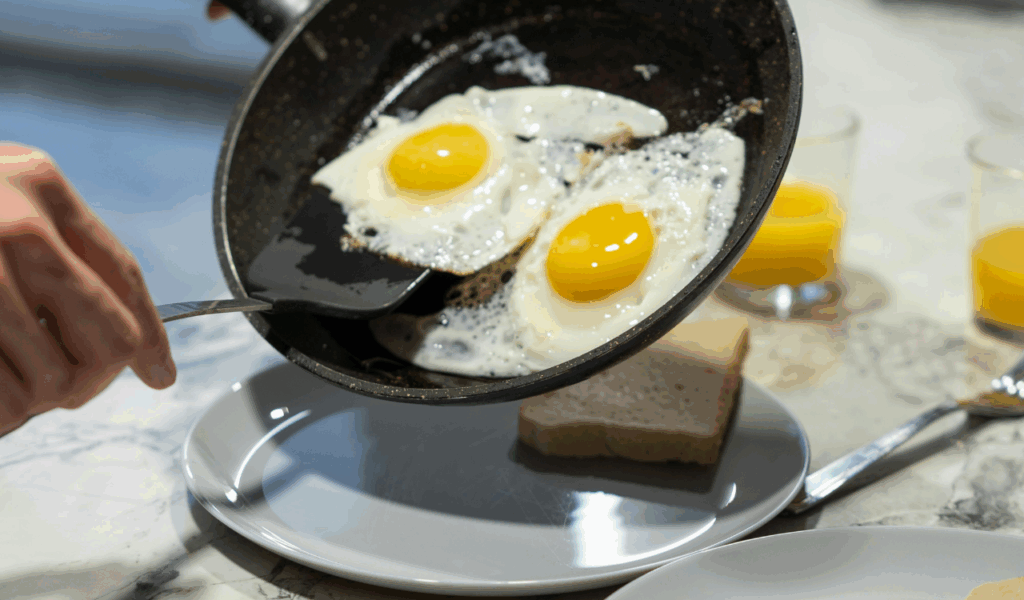 Covering Fried Eggs for Perfect Yolks