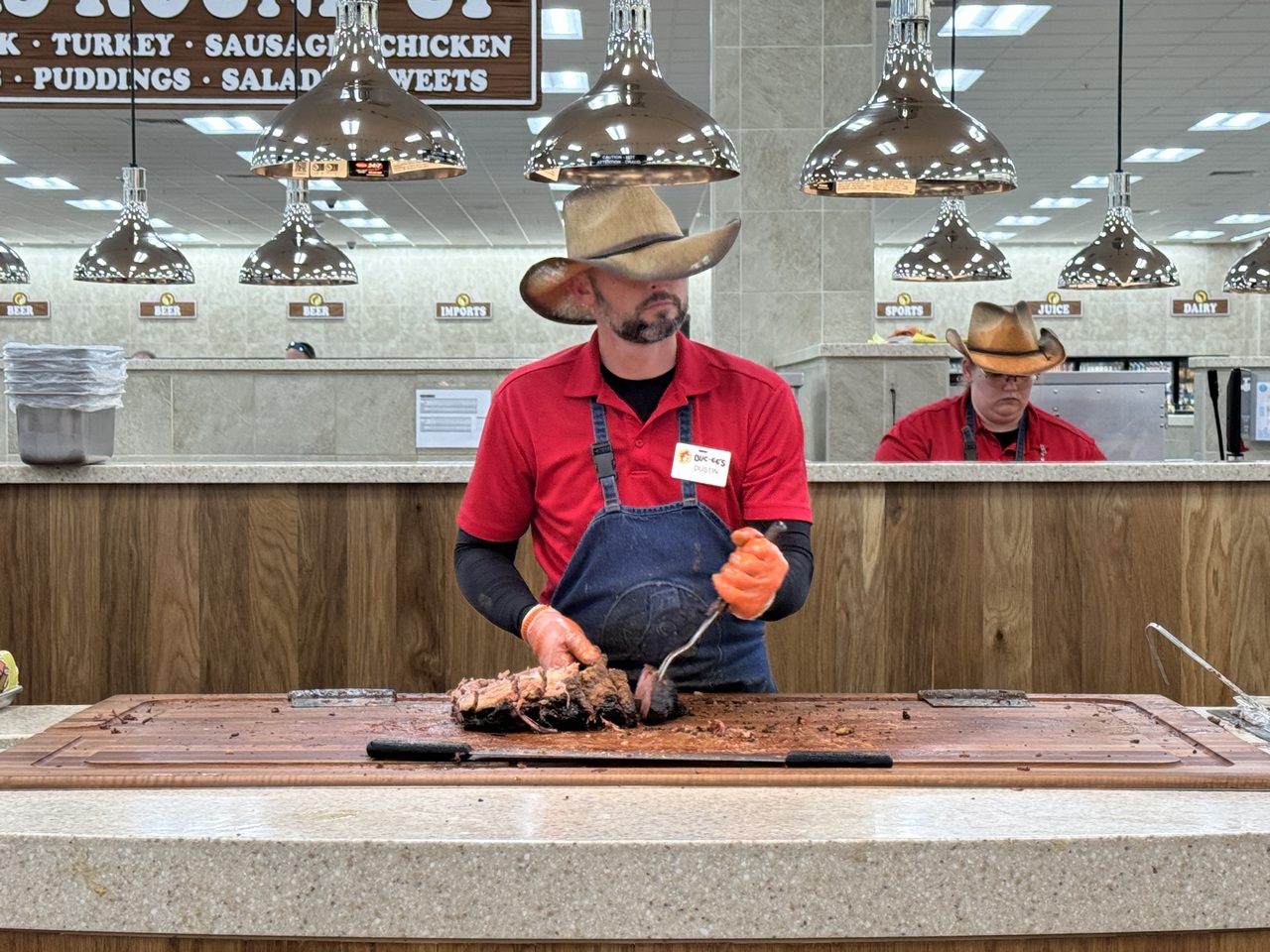 Buc-ee's pitmaster working on a brisket