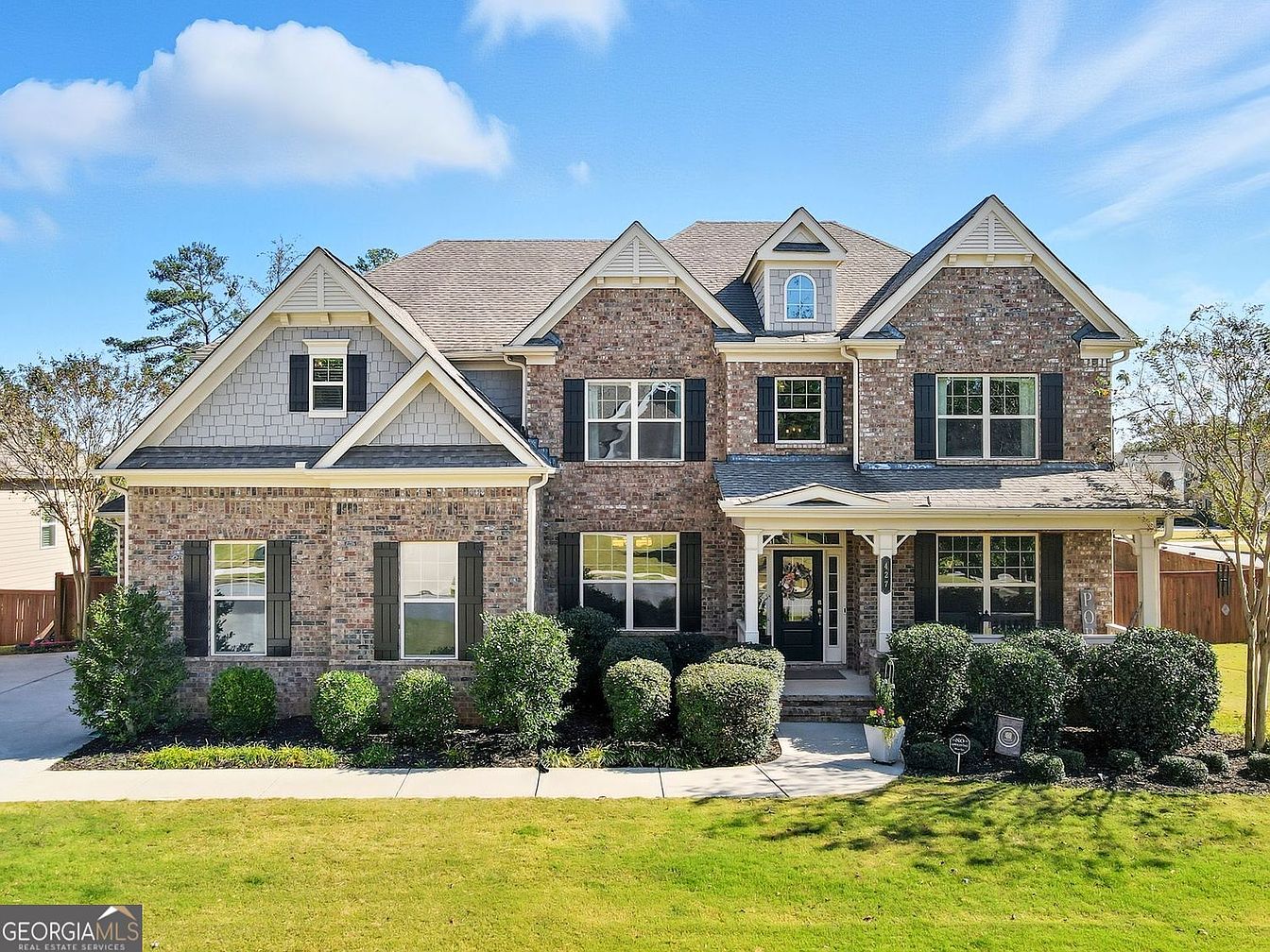 Experience Contemporary Living in a 2018 Woodstock, Georgia Home With a Two-Story Foyer, Sunroom, and Smart Technology