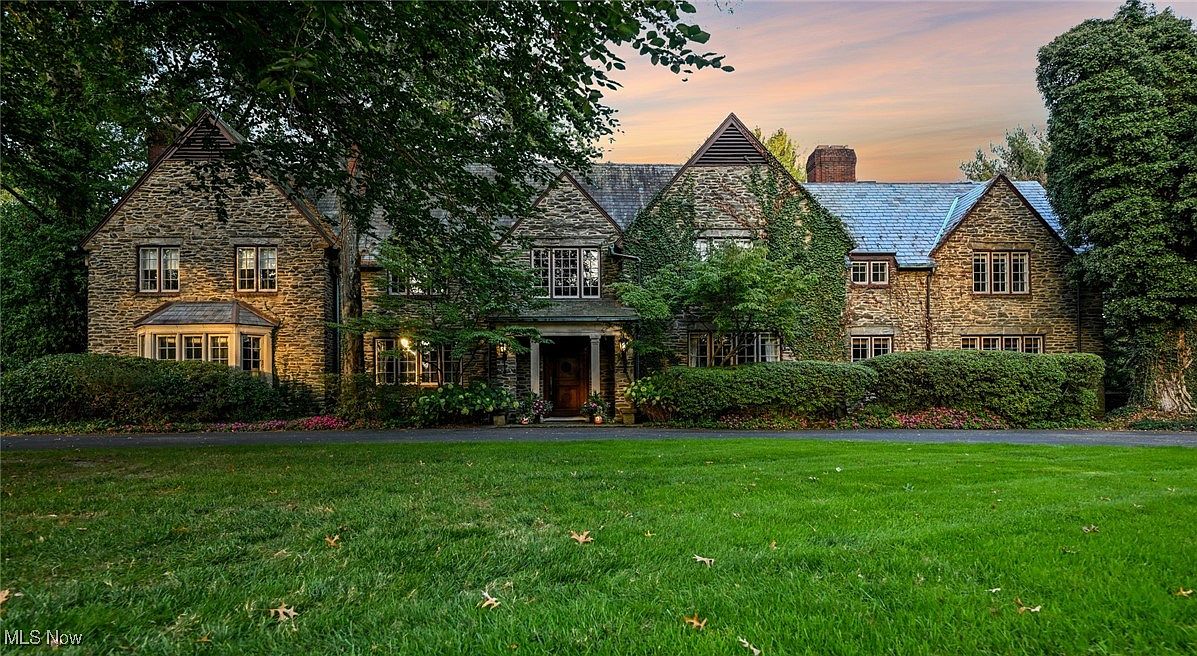 Experience 1929 Tudor Revival Estate in Akron, Ohio, With Stone Exterior, Reverse Staircase, and 2 Acres of Gated Gardens