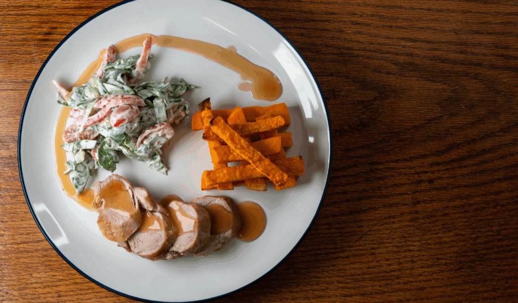 Eat at a moderate pace and be mindful of portion size