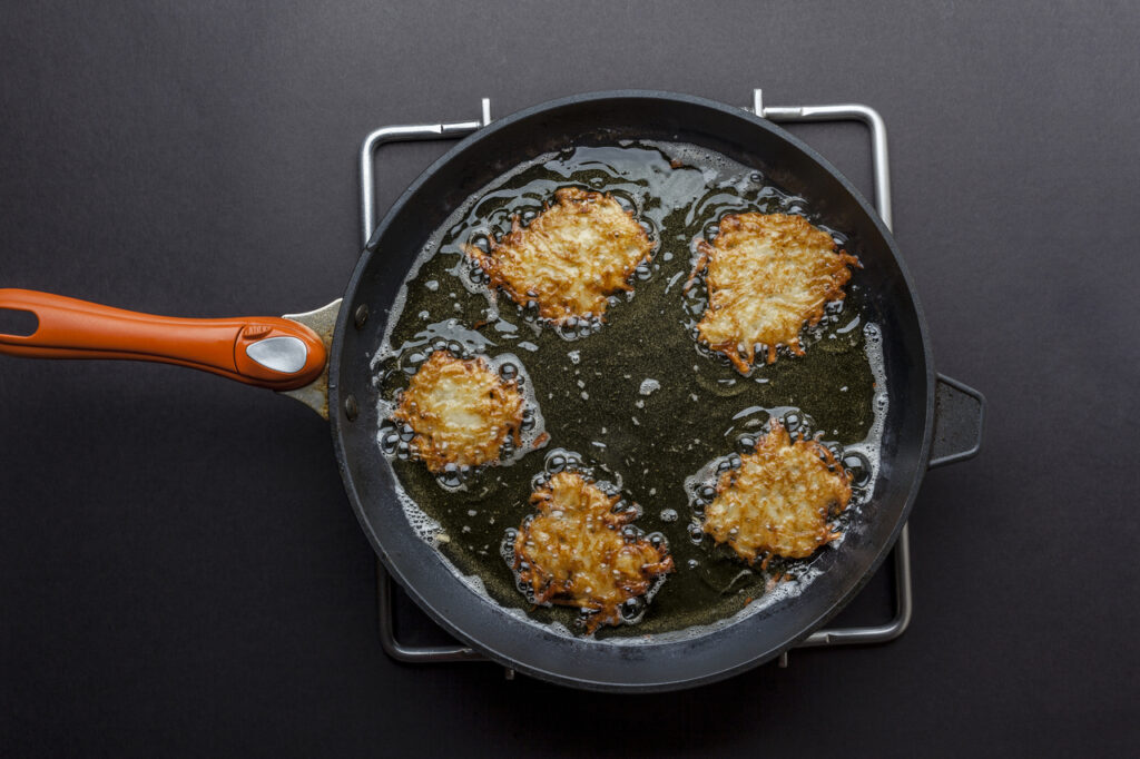 Fritters being fried