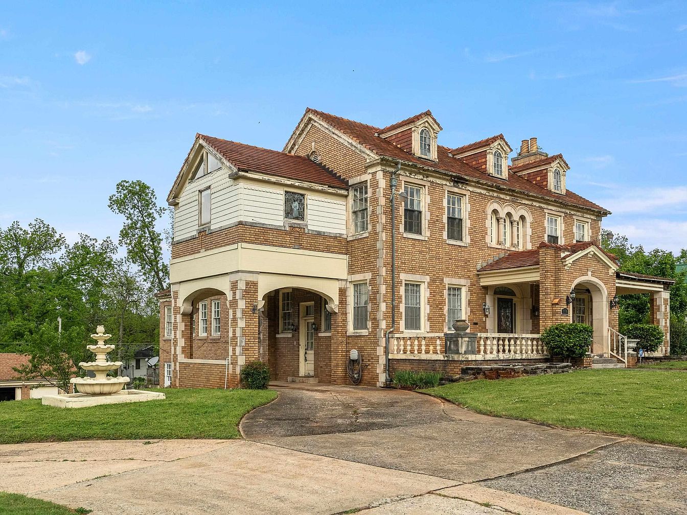 Experience 1930 Schilleci Brick Manor in Alabama With Exquisite Stained Glass, High Ceilings, and Elegant Period Details