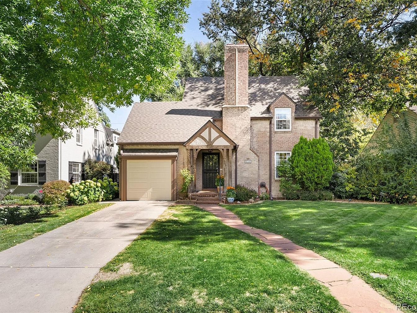 Charming 1940 Denver Gem in Colorado Featuring Classic Doors, a Sunroom Wrapped in Windows, and a Serene Backyard Oasis
