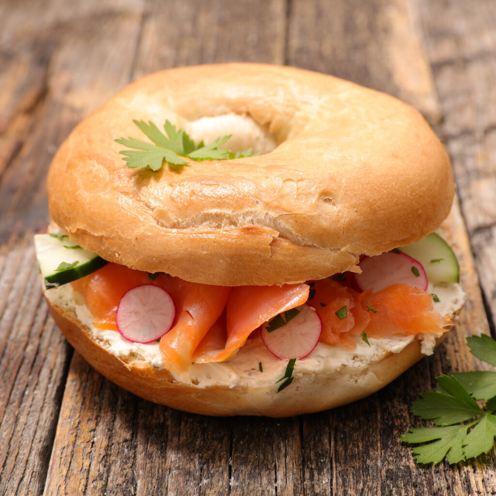 Smoked salmon, cream cheese, egg, and tomato on a bagel