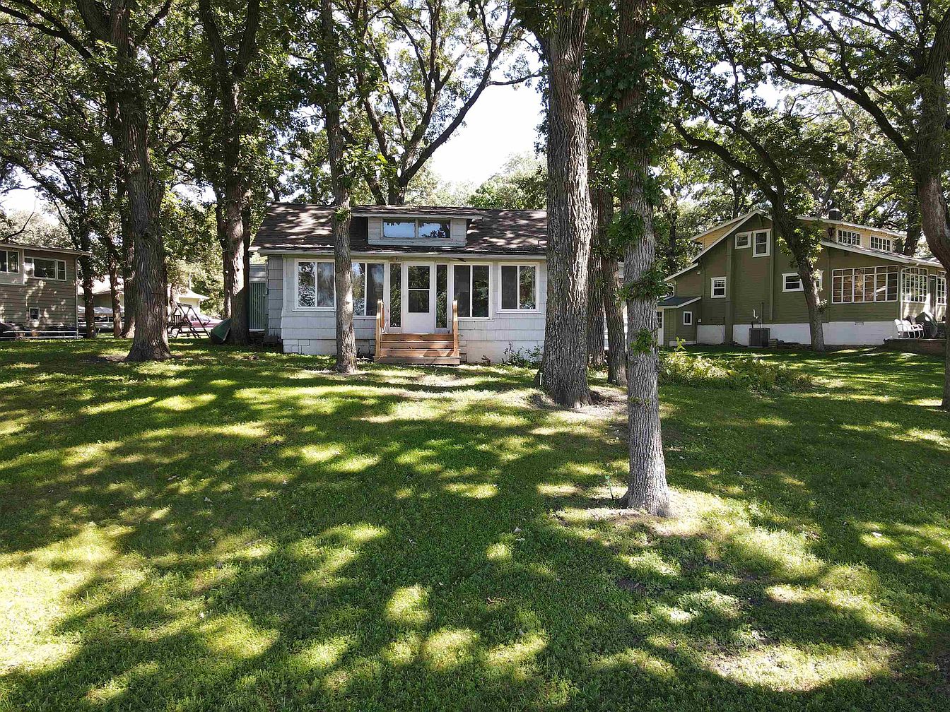 Spacious 1918 Lake Cottage in Milford, Iowa, With 168 Feet of Turtle Lake Frontage and Nearly Half an Acre Among Mature Trees