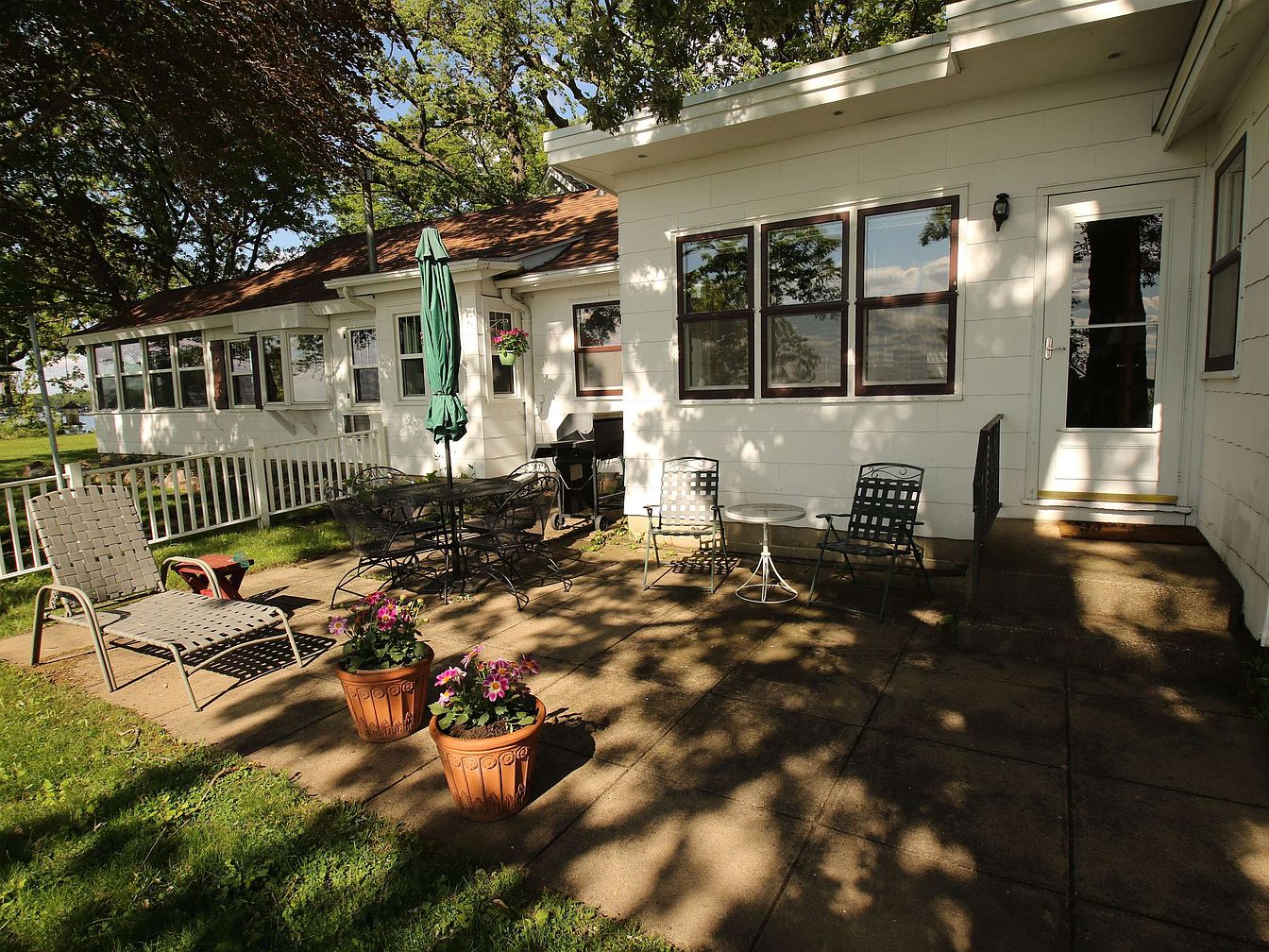 Tour this 1920 Okoboji Century Cottage in Arnolds Park, Iowa, With 120 Feet of Park Frontage and Panoramic Lake Views