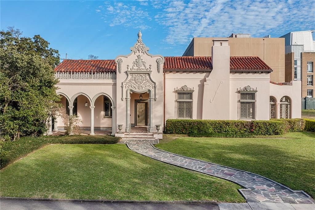 Iconic 1927 Spanish Revival in New Orleans, Louisiana With Exquisite Tilework, 17′ Painted Ceilings, and Leaded Glass Windows