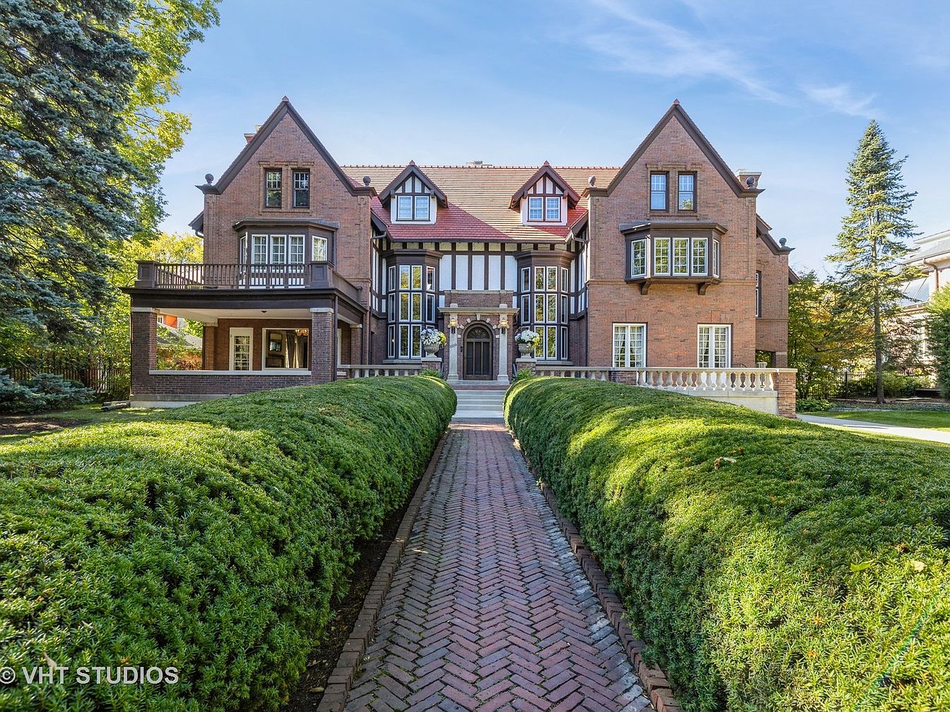 Grand 1912 Tudor Landmark in Evanston, Illinois With a Two-Story Great Hall, Four Fireplaces, and a Historic Coach House