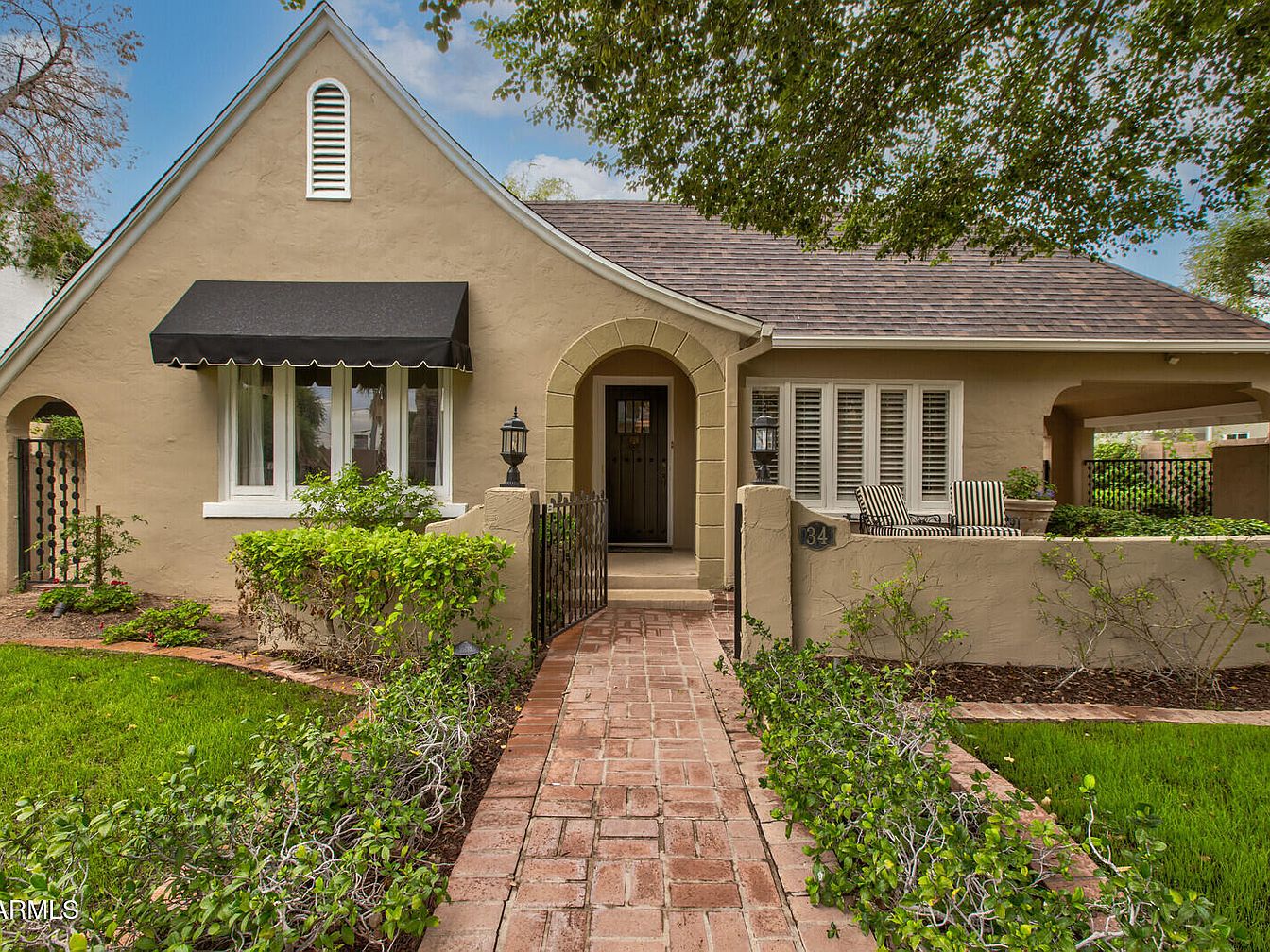 Visit 1927 Tudor Revival in Phoenix, Arizona, With a Gable Roof and Lush Benjy Levinson Landscaping in the Willo District