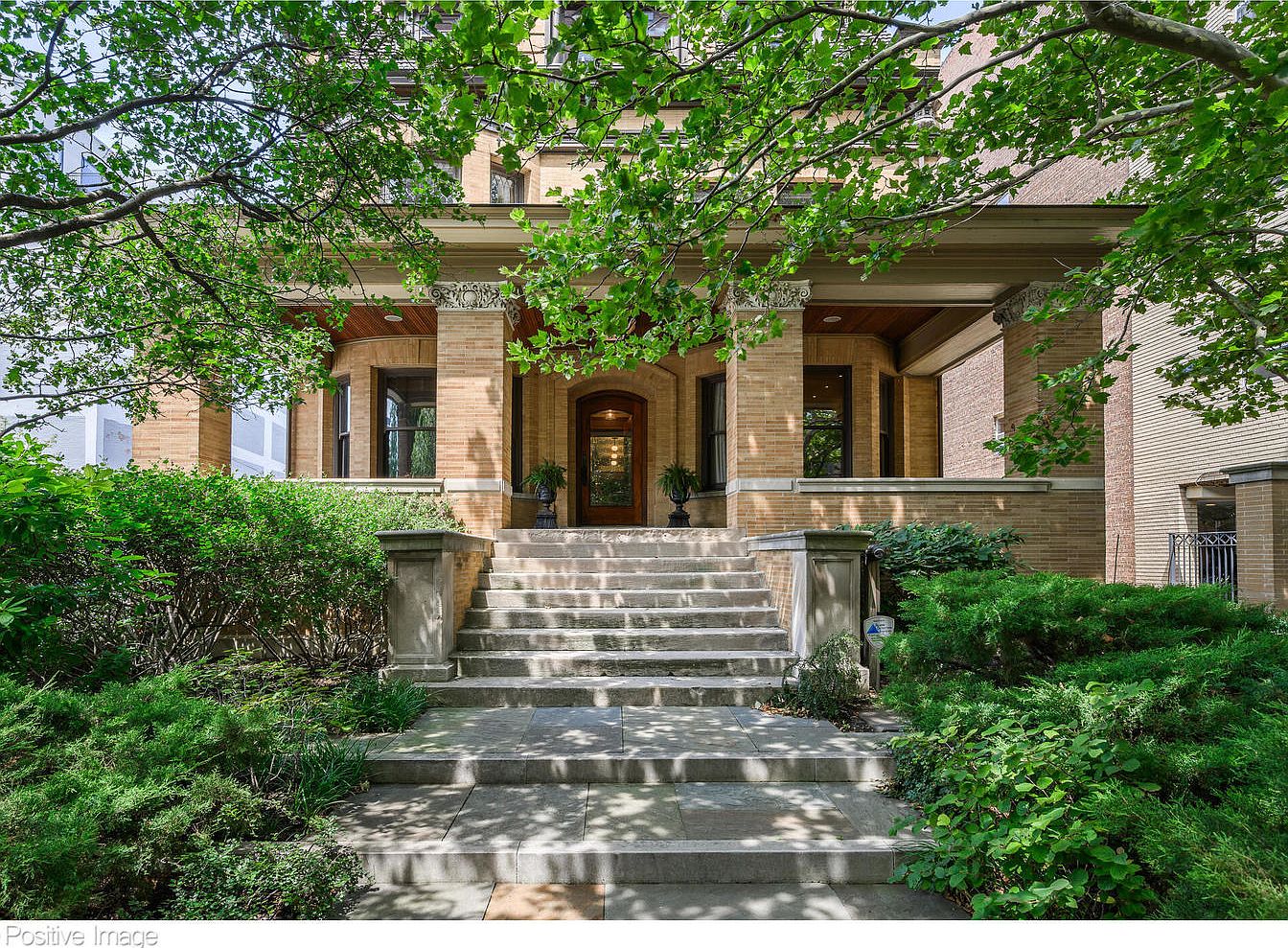 Grand 1903 Chicago Masterpiece in Illinois Featuring Hand-Carved Staircase, Restored Fireplaces, and Lush Secret Gardens
