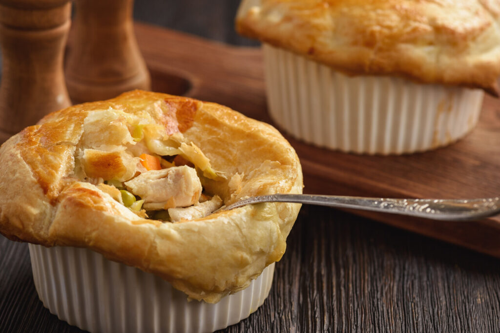 Chicken pot pie with carrot, greas peas and cheese.