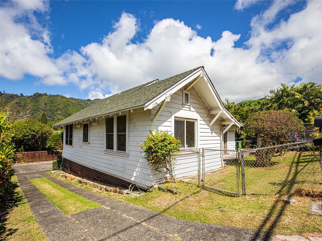 white sofa near green christmas tree