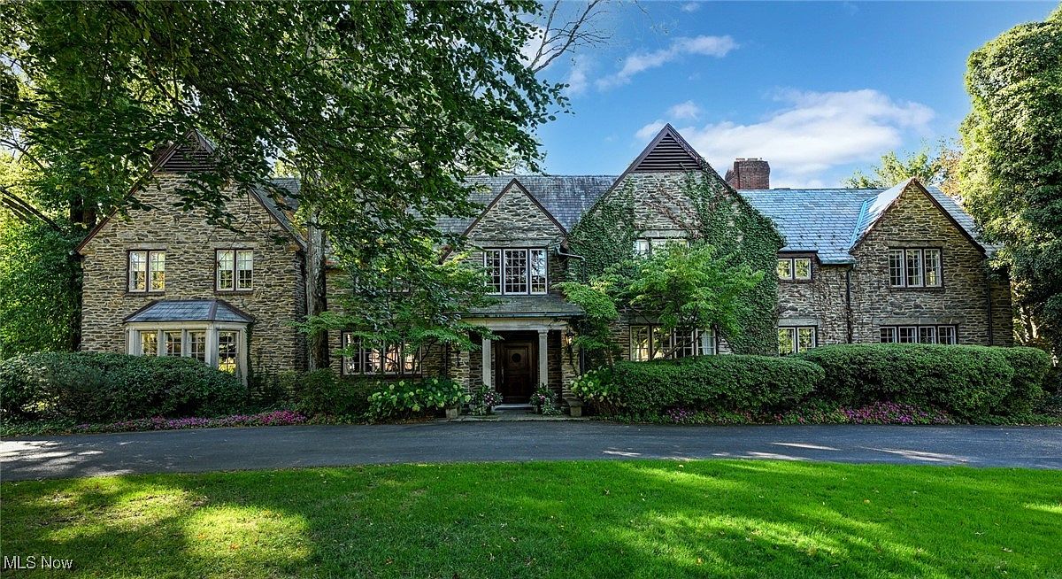 Magnificent 1929 Tudor Revival in Akron, Ohio, with Luxurious Living Space, Gardens, and a Family Room with Custom Kitchen