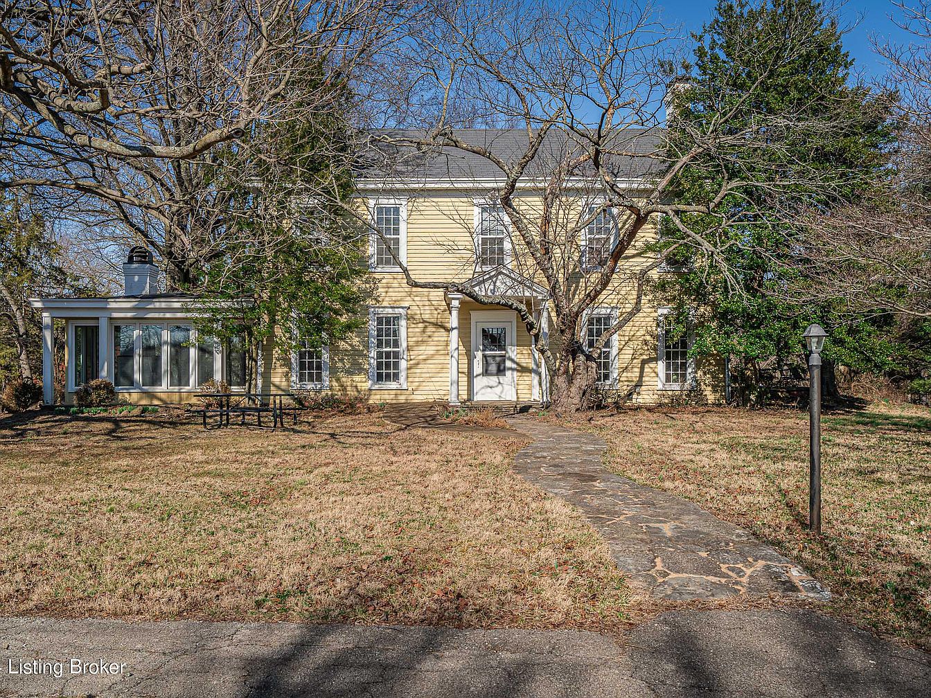 Own a 1900 Farmhouse Estate in Prospect, Kentucky Featuring Yellow Architecture, 9.7 Acres, Two Barns, and a Smokehouse Studio