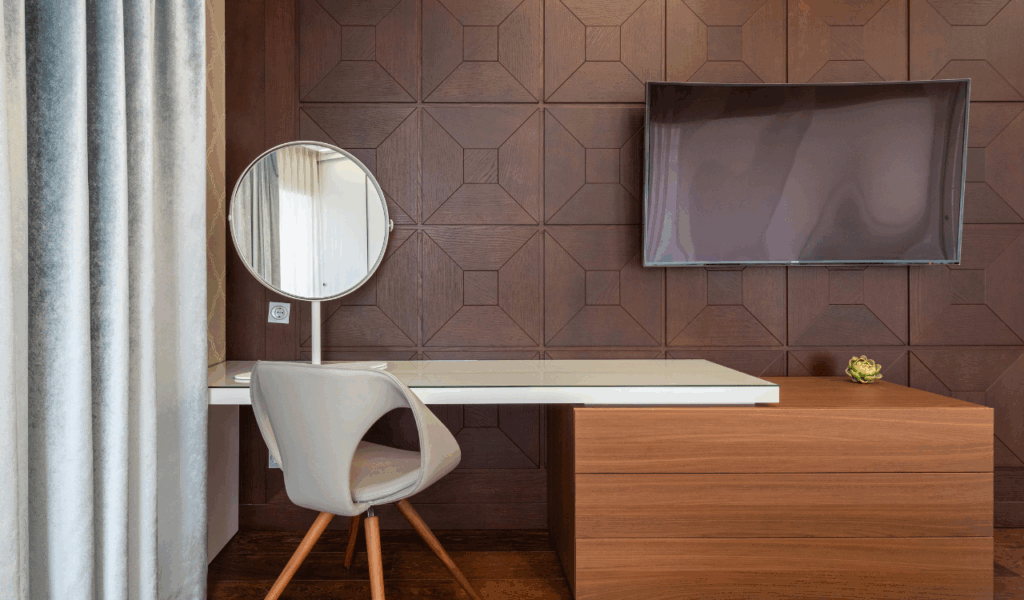 Desk Placed Near Entertainment Screens