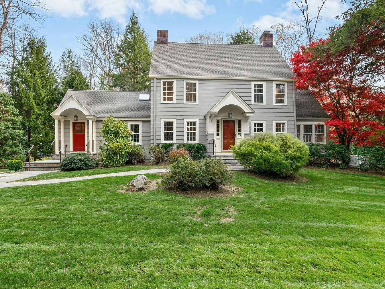 Explore This 1928 Colonial Home in Westport, Connecticut, Featuring Fireplaces, Custom Built-Ins, and Lush Landscapes