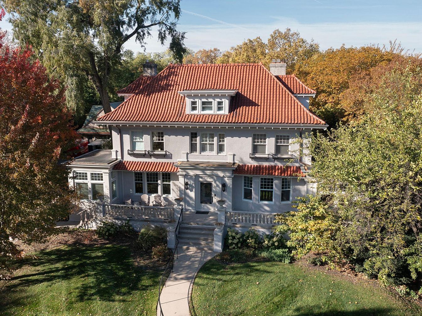 1910 Retreat in Minneapolis, Minnesota, Showcasing Expansive Views of Lake and a Guest Suite Over a Heated Garage