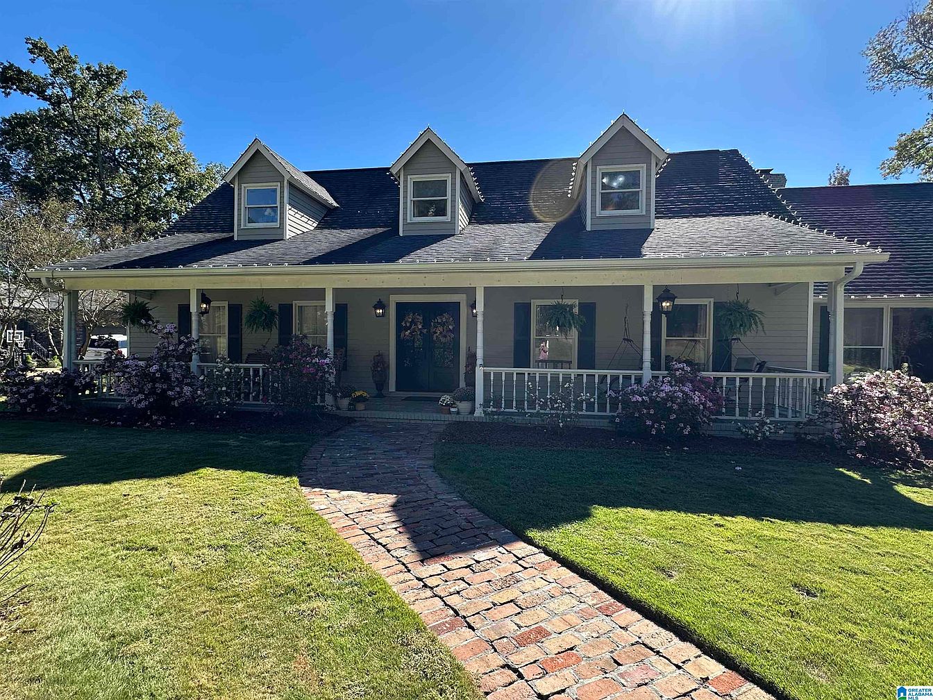 Elegant 1979 Haven in Vestavia, Alabama, Featuring Two Master Suites, a Screened Porch with Gas Fireplace, and a Pool Oasis