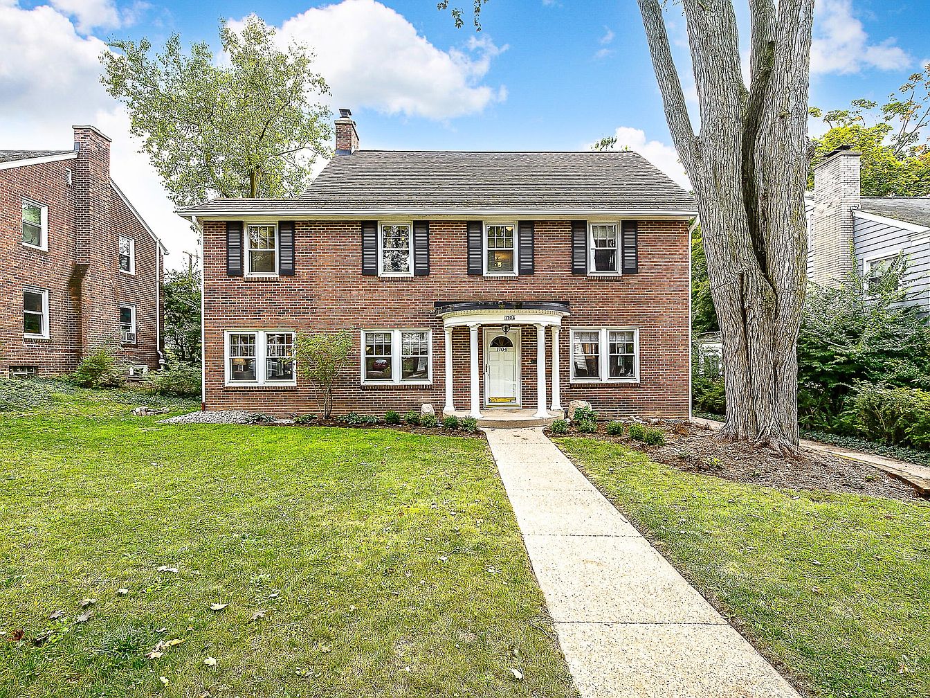 Experience a 1929 Brick Gem in Ann Arbor, Michigan with Original Trim, Hardwood Floors, and a Spacious 3rd Floor Retreat