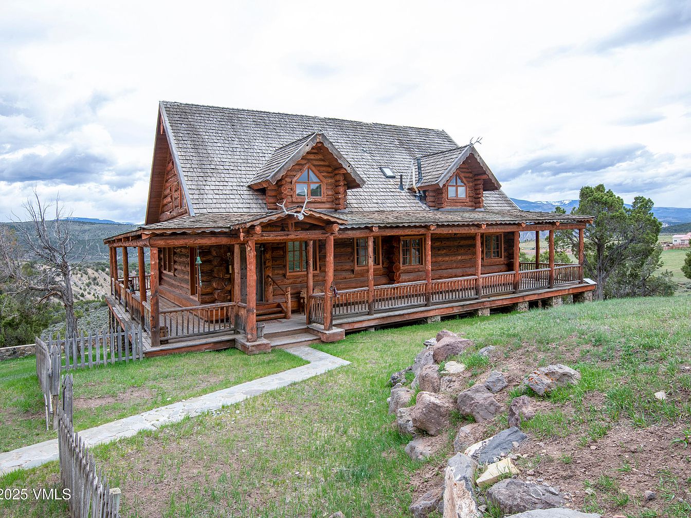 Stunning 1994 Alpine Log Home in Eagle, Colorado Nestled on 35 Acres with Mountain Views and Expansive Wraparound Deck
