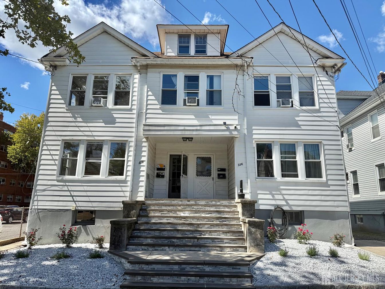 Historic 1928 Highland Park, New Jersey 4-Family Investment Property with Ample Storage, and $133,800 Annual Income Potential