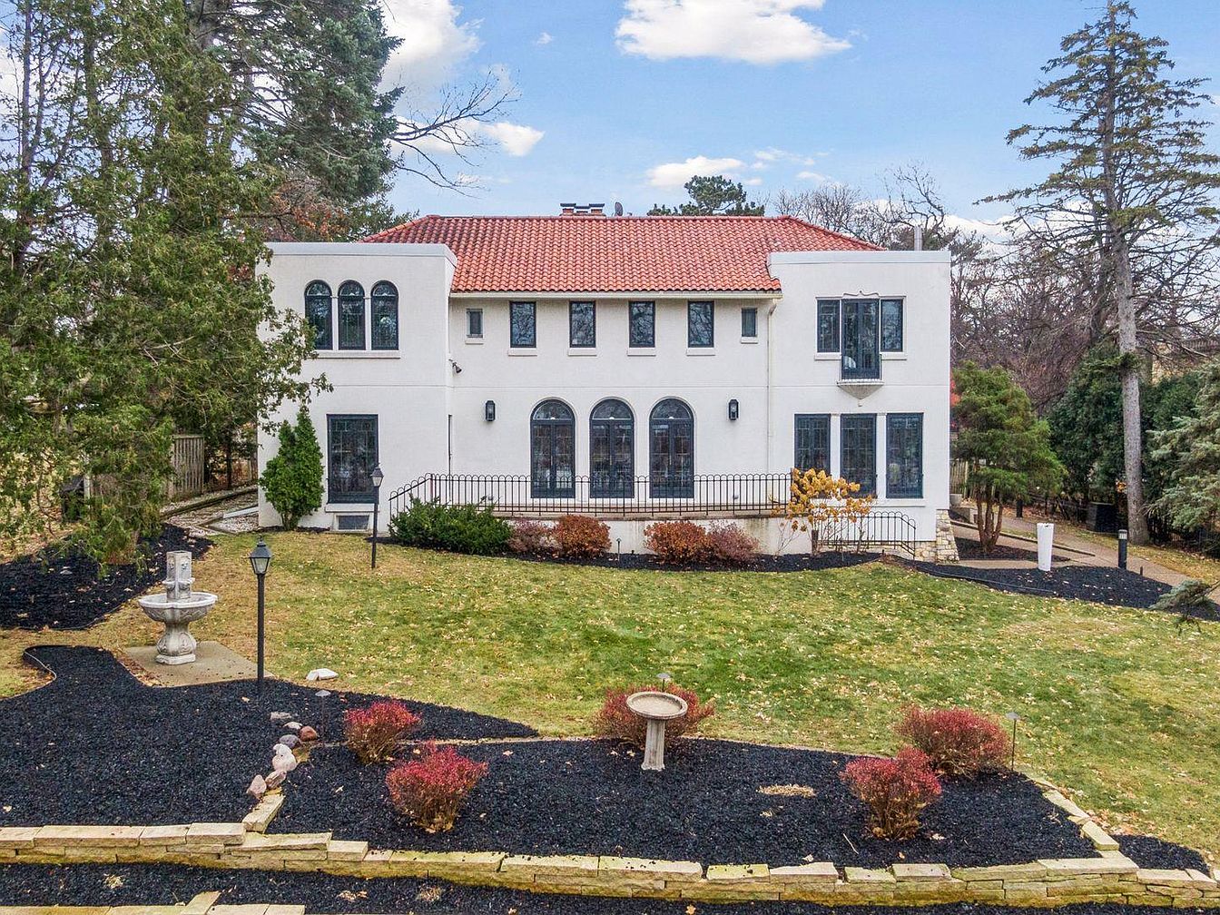 Unique 1923 Mediterranean-Style Home in Minneapolis, Minnesota with Stunning Views, a Rooftop Deck, and an Inviting Lap Pool
