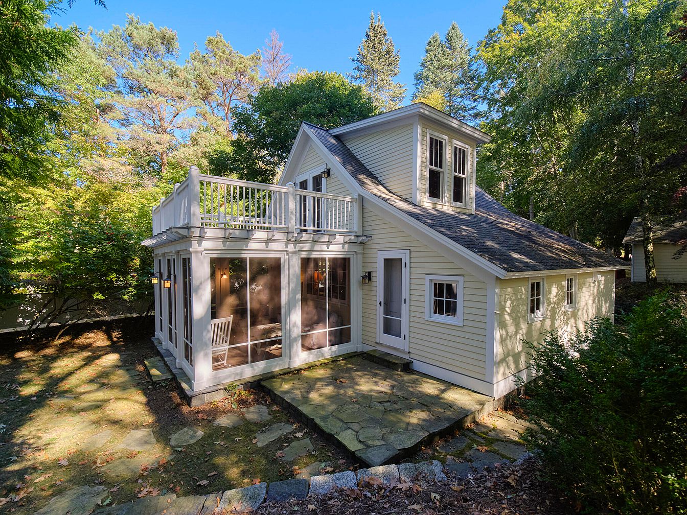 Step Inside a 1900 Cottage in Bear Lake, Michigan, Featuring Original Woodwork, a Brick Fireplace, and Lake Michigan Views