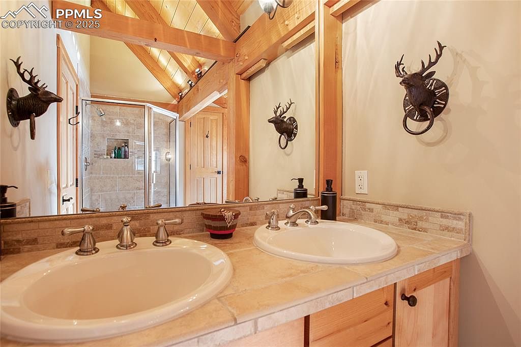 Close-up of a hand flushing a modern toilet, emphasizing hygiene and water conservation.