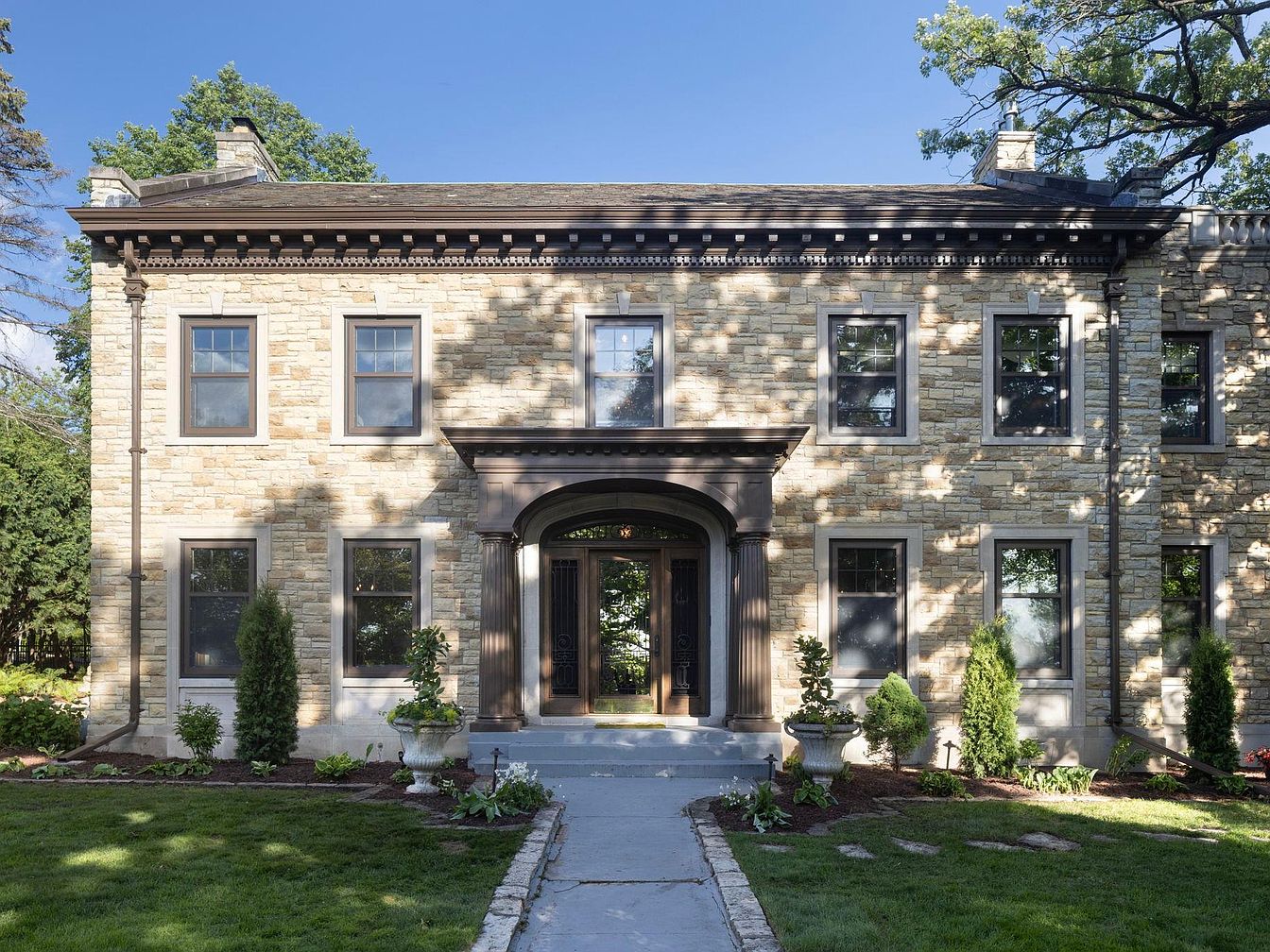 1926 Minneapolis Masterpiece Featuring Lake Harriet Views, Custom Finishes, and a Library with a Barrel-Vaulted Ceiling