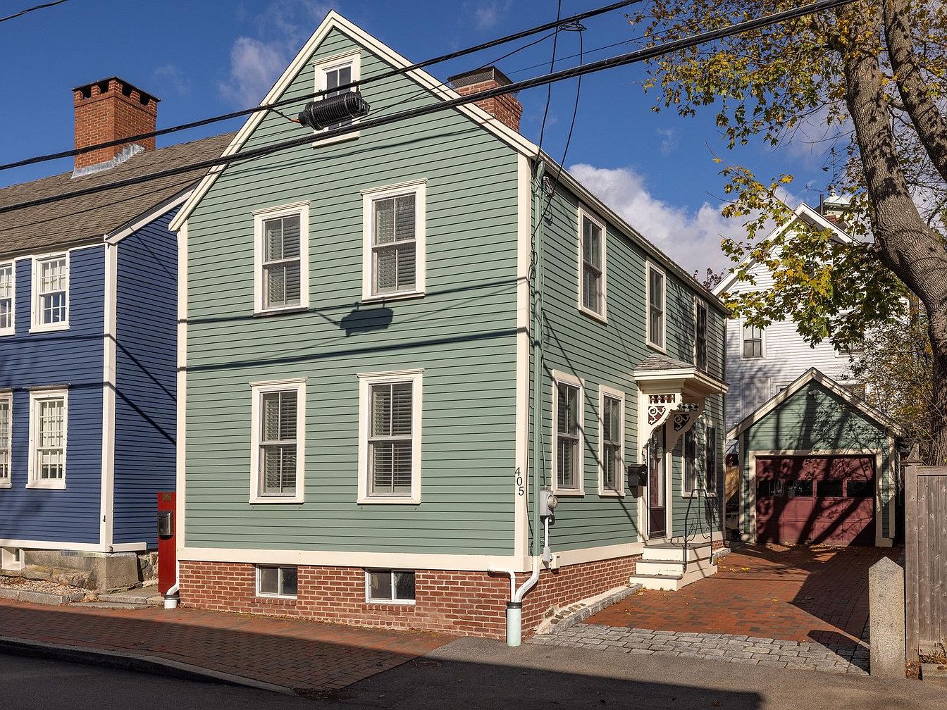 Explore 1780 Historic Home in Portsmouth, New Hampshire, Featuring Exposed Beams and a Serene Stone Patio Retreat