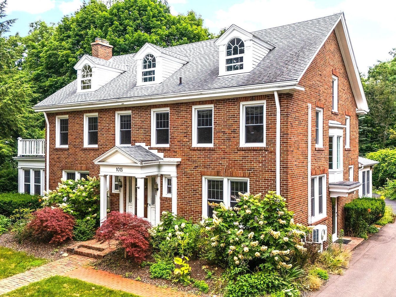 Experience Timeless Elegance in a 1908 Ann Arbor Gem in Michigan with Hardwood Floors, Multiple Fireplaces, and Expansive Gardens