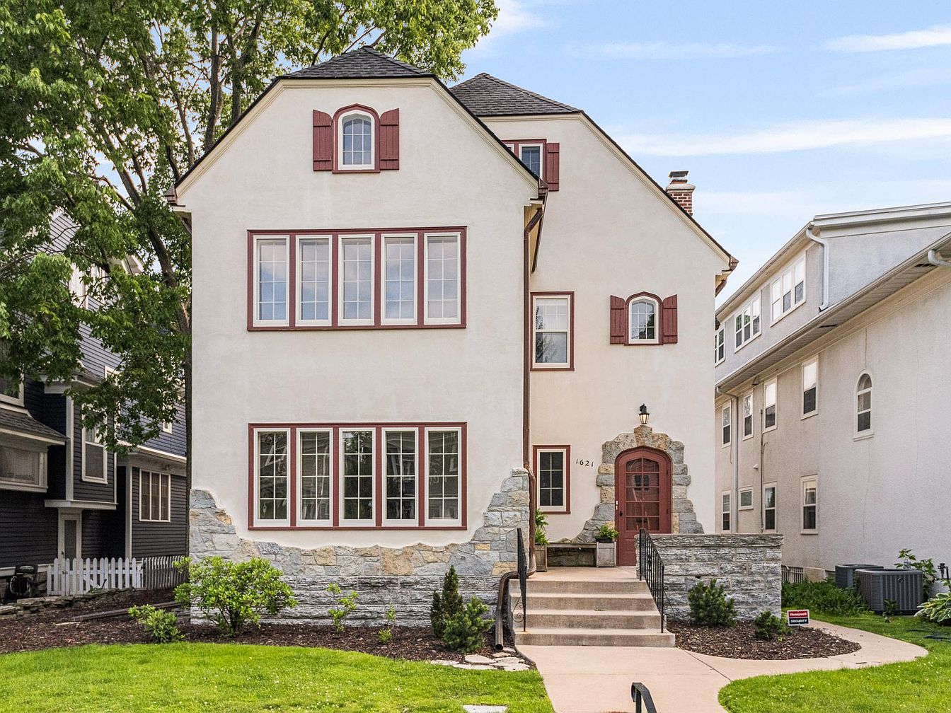 Experience Elegance in a 1913 Triplex in Minneapolis, Featuring Original Hardwood Floors and Direct Lake of the Isles Access