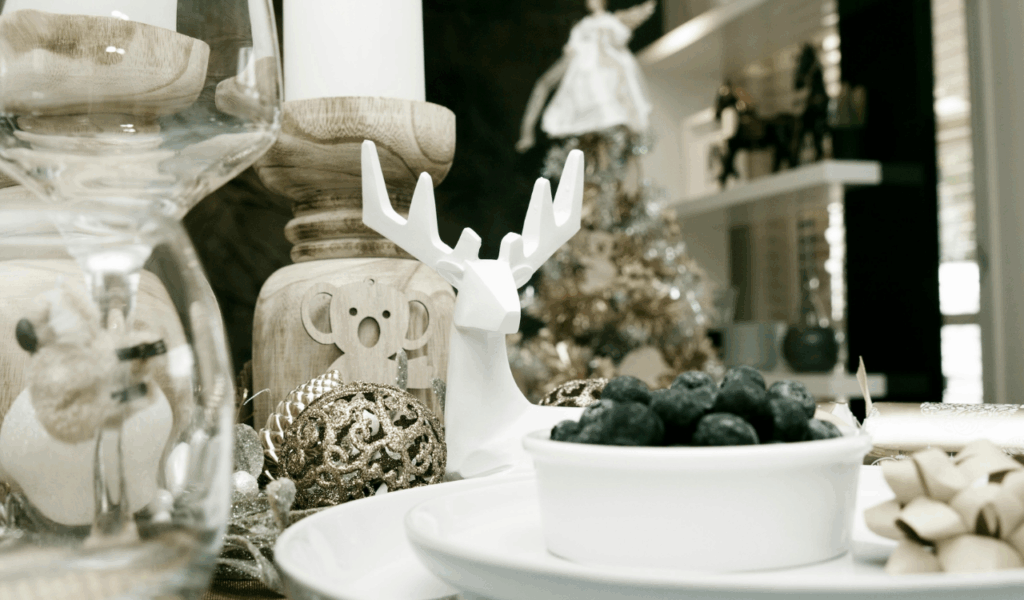 Seasonal Figurines Sitting Between Place Settings