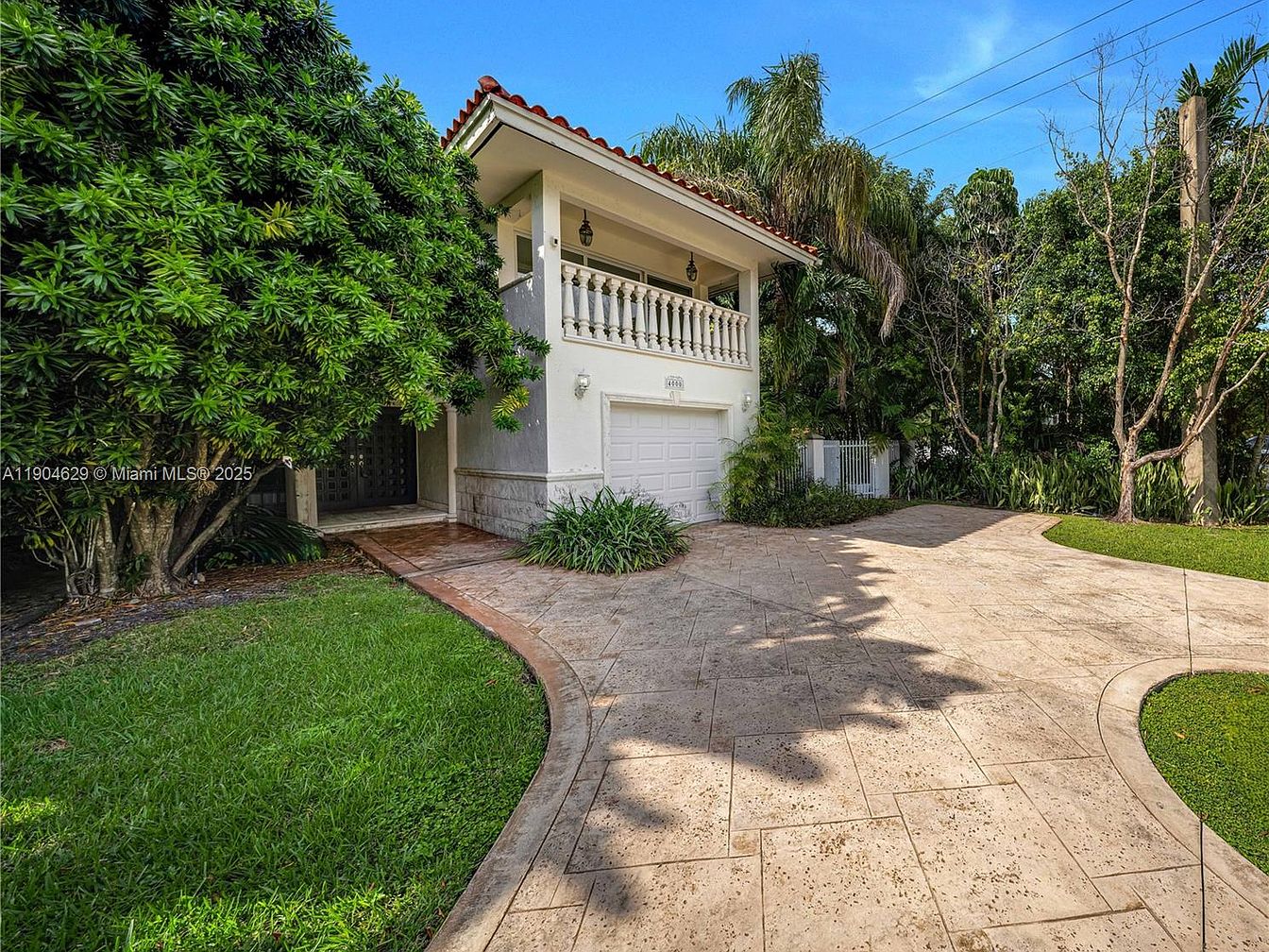 Bright and Spacious 1977 Two-Story Home in Coral Gables, Florida, with High Ceilings, Generous Living Areas, and a Private Balcony