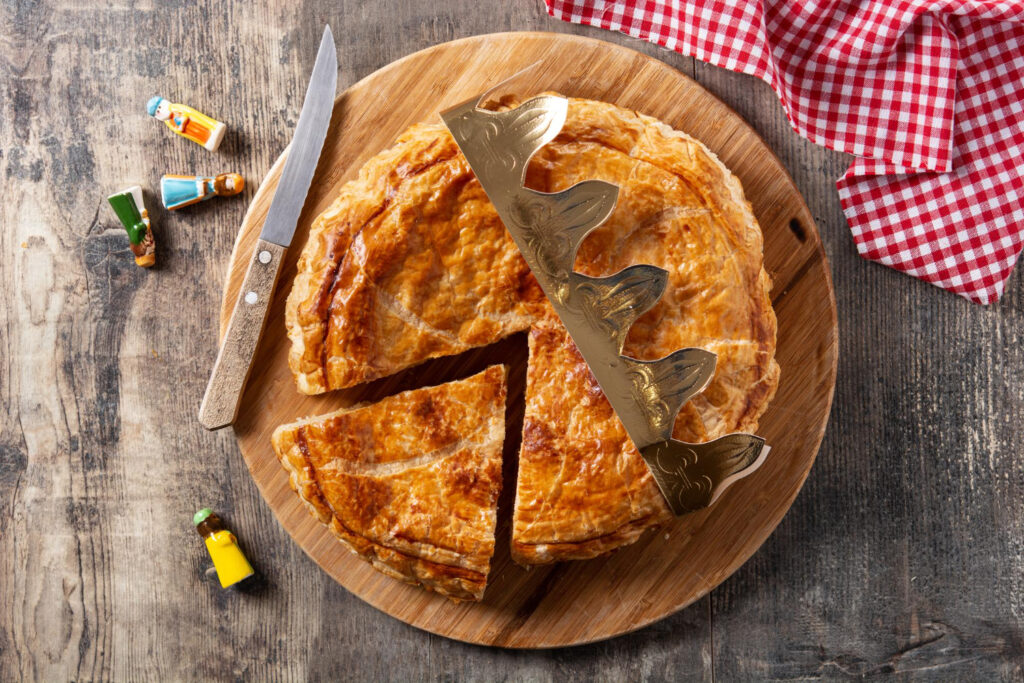 Homemade chicken pot pie with flaky crust and creamy filling visible after slicing