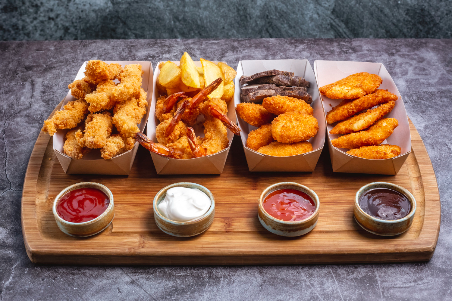 Plate of assorted deep-fried state fair treats on a tray with golden, crispy coatings