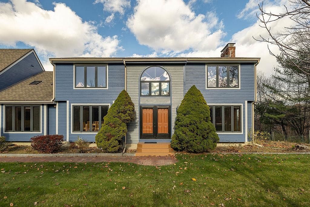 Stunning 1988 Retreat in Bow, New Hampshire, Featuring Mountain Views, Expansive Sunroom, and En-suites in Every Bedroom