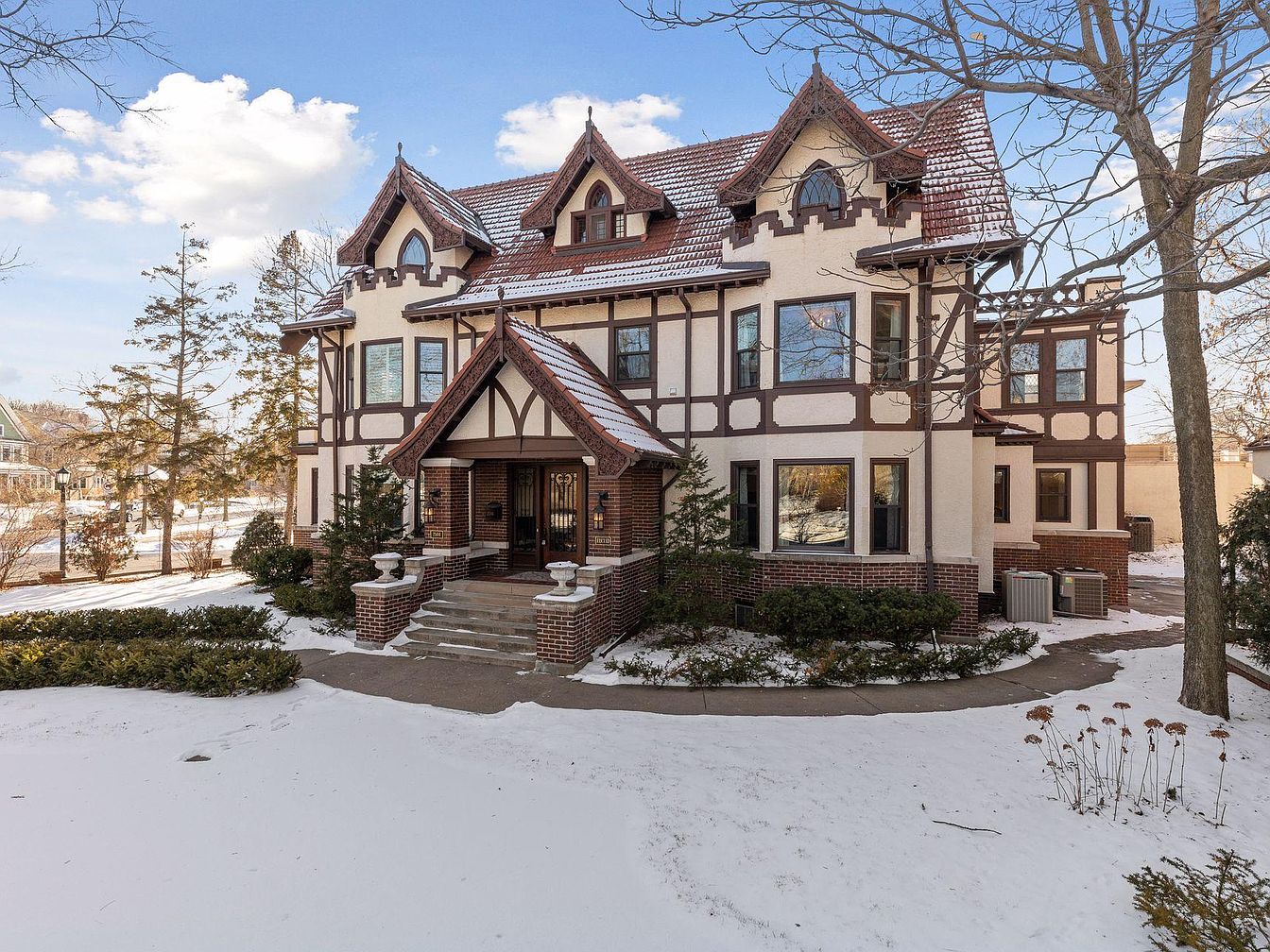 1909 Tudor Mansion in Minneapolis, Minnesota Featuring Stunning Millwork, a Carriage House, and Steps from Lake of the Isles