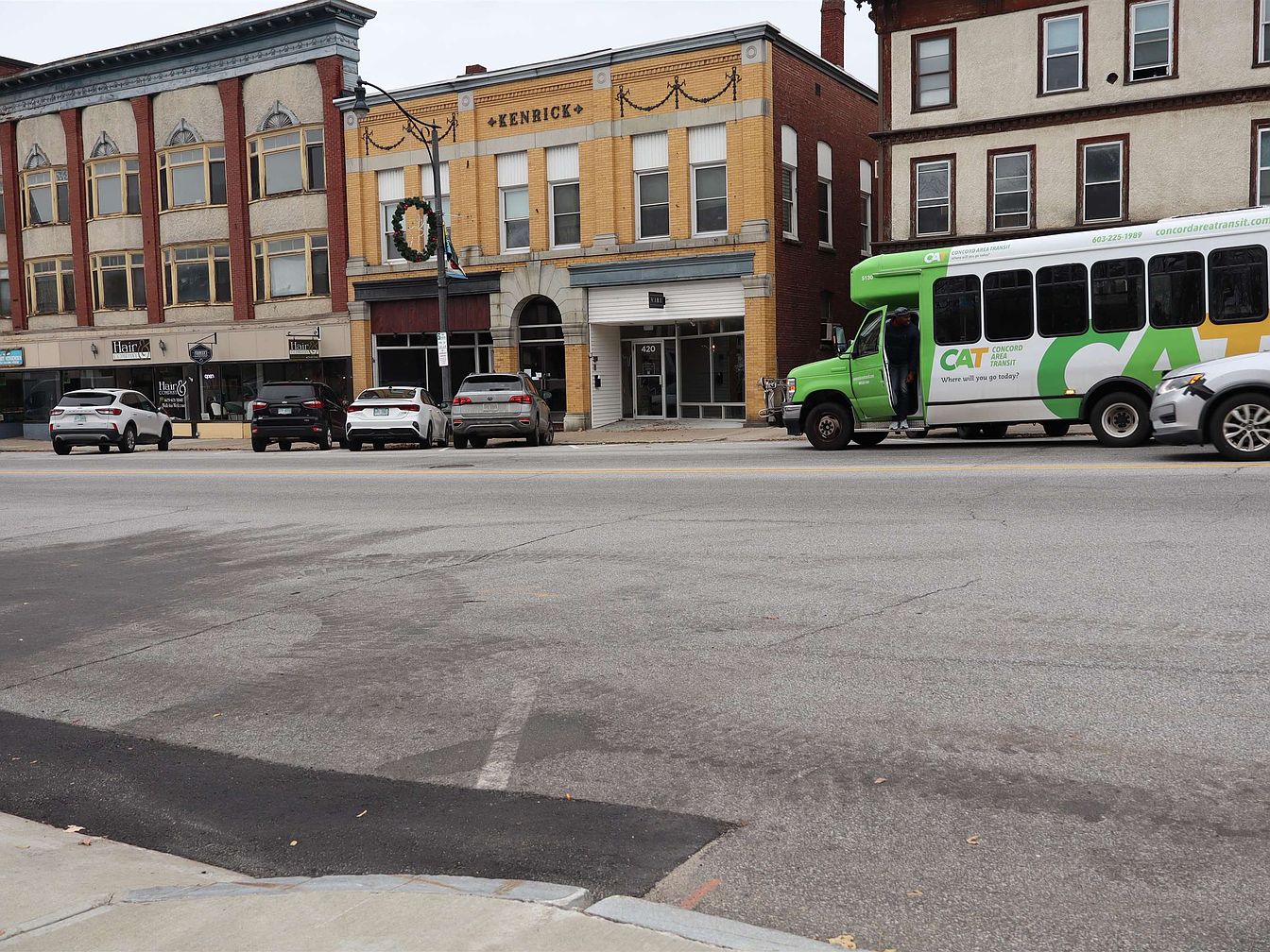 1920 Historic Kenrick Building in Franklin, New Hampshire Featuring 5 Residential Units, 2 Commercial Spaces, and Brick Construction