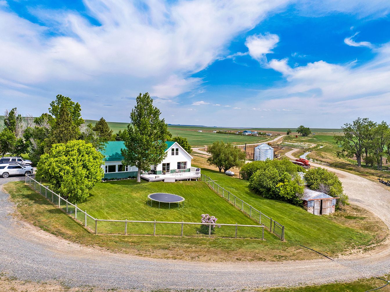 Unique 1920 Ranch in Sun River, Montana, Featuring Expansive Views, 329+ Acres of Productive Farmland, and Cattle Infrastructure