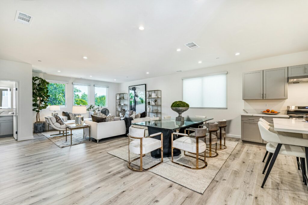 Modern bright living room with airy furniture layout and natural light creating an open spacious feel
