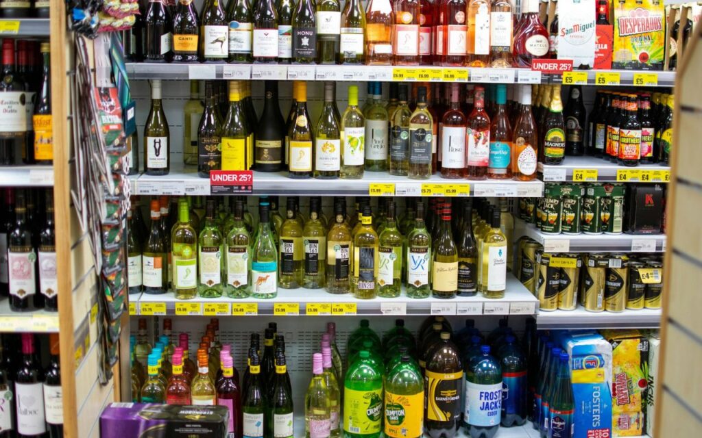 Close-up of a six-pack of craft beers in a local grocery store, illustrating beers shipped far from their original brewery