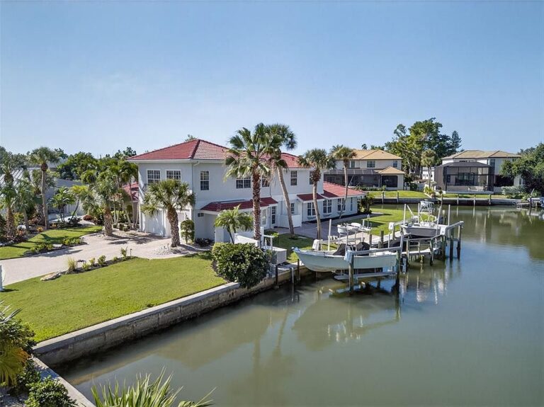 Amazing 1970 Waterfront Retreat in Sarasota, Florida with 268 Feet of Deep Water Docks and Expansive Outdoor Spaces