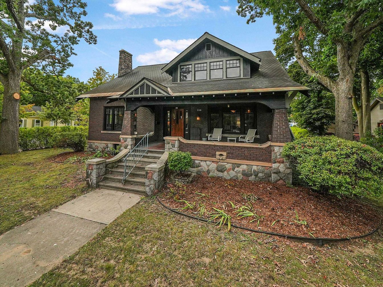 Iconic 1915 Old Town Bungalow in Traverse City, Michigan with Maple Hardwood Floors, 9′ Coffered Ceilings, and a Grand Fireplace