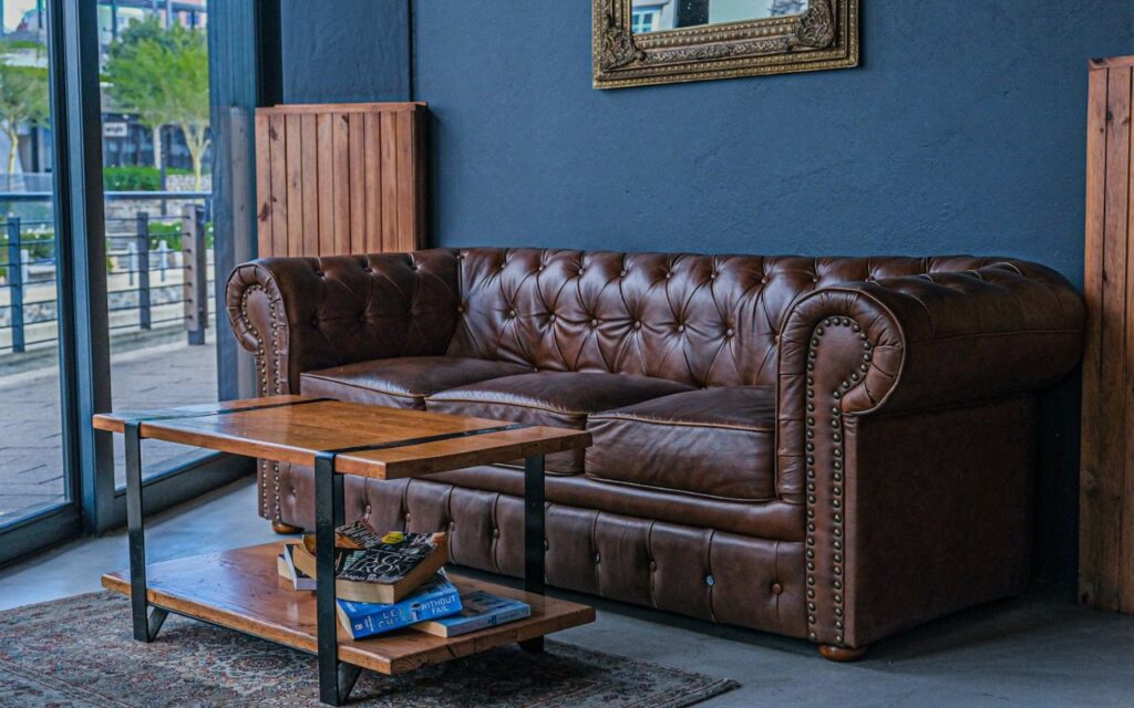 Close-up of embossed leather upholstery with fine cracks forming along decorative patterns