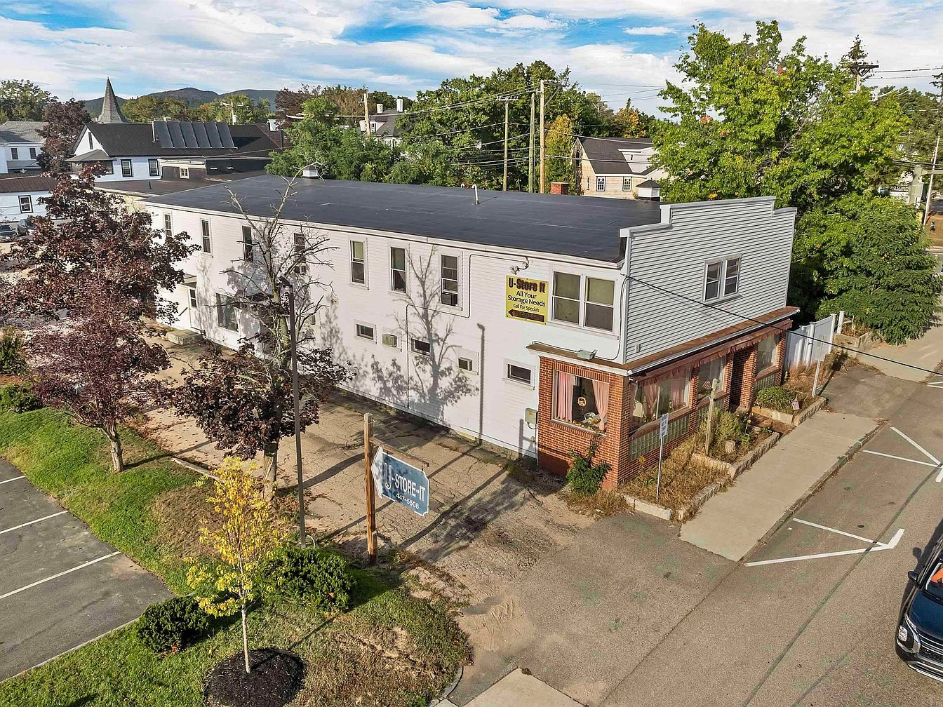 Prime 1920 Mixed-Use Investment Opportunity in Conway, New Hampshire, Featuring 7 Residential Apartments and 86 Storage Units