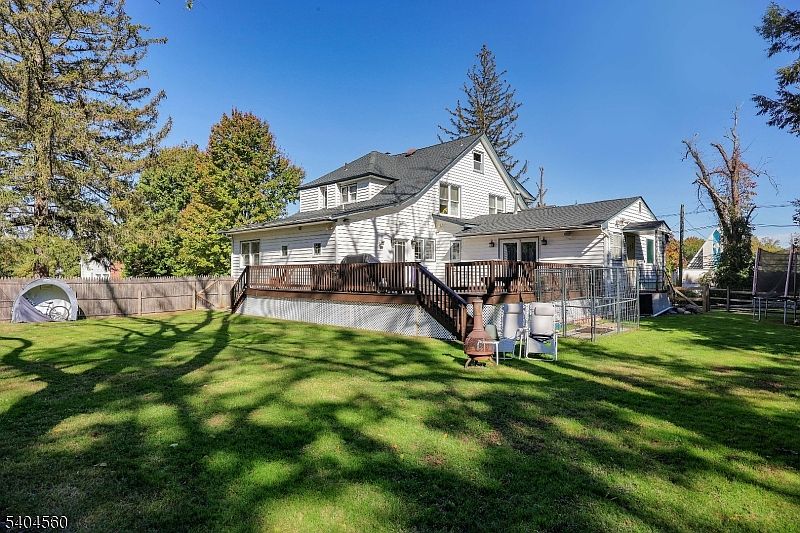 Timeless 1910 Colonial Home in Scotch Plains, New Jersey, Featuring a Stone Fireplace, Elegant Primary Suite, and Expansive Acreage